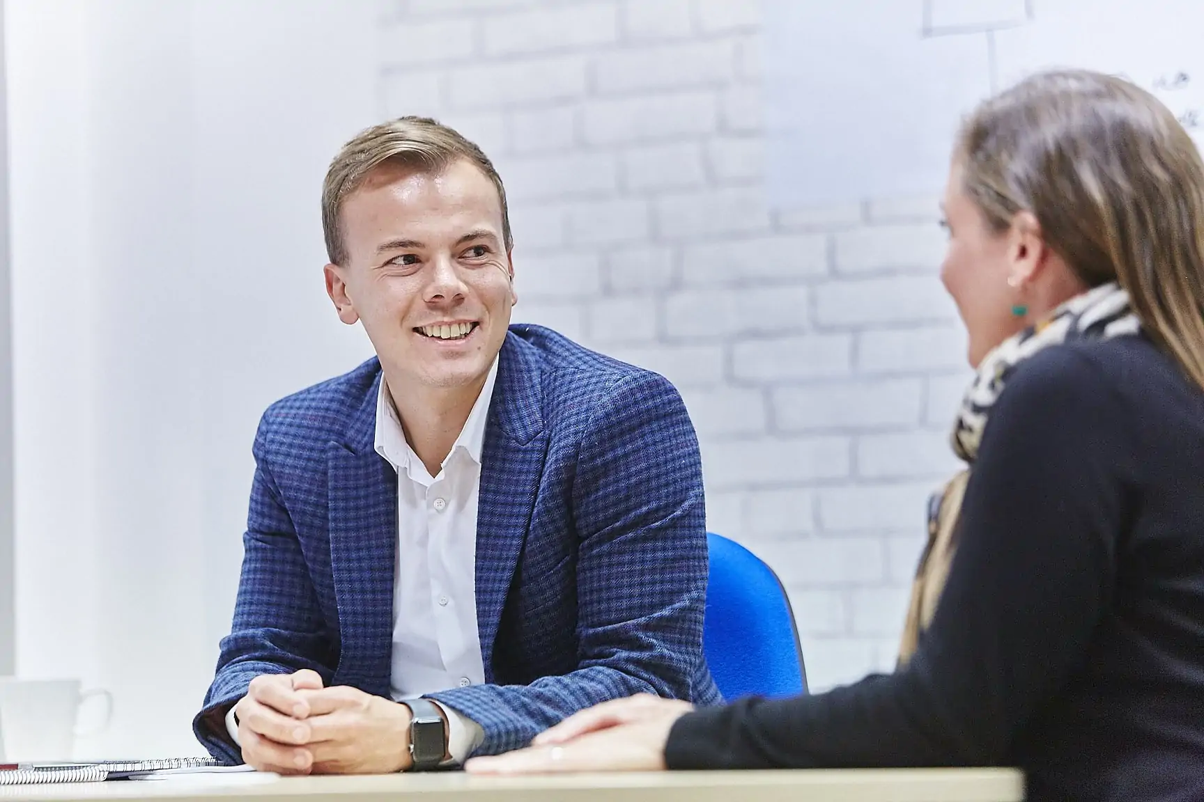 Man smiling in meeting