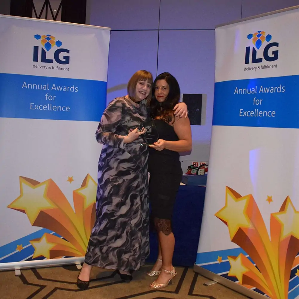 Two ILG employees accepting their awards