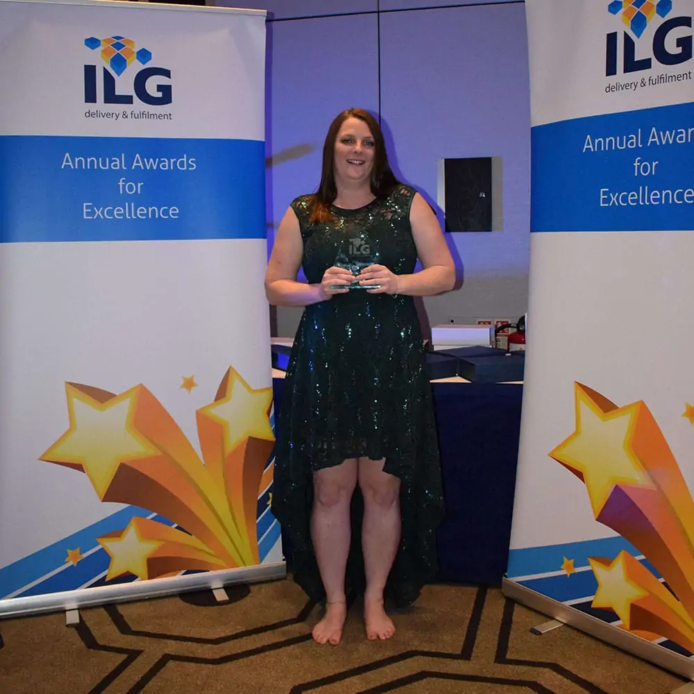 ILG employee accepting award