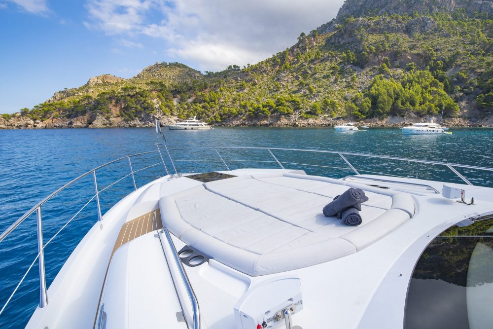 Luxury yachts in front of island