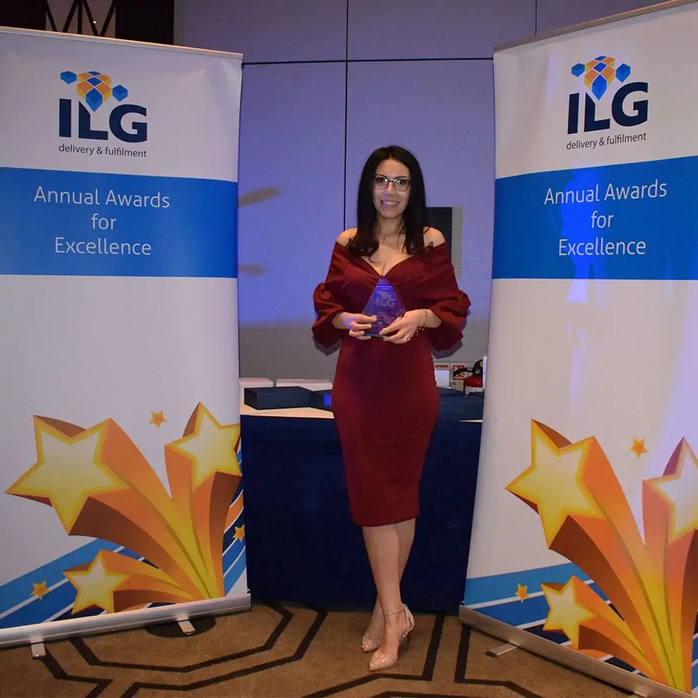 ILG employee accepting her award