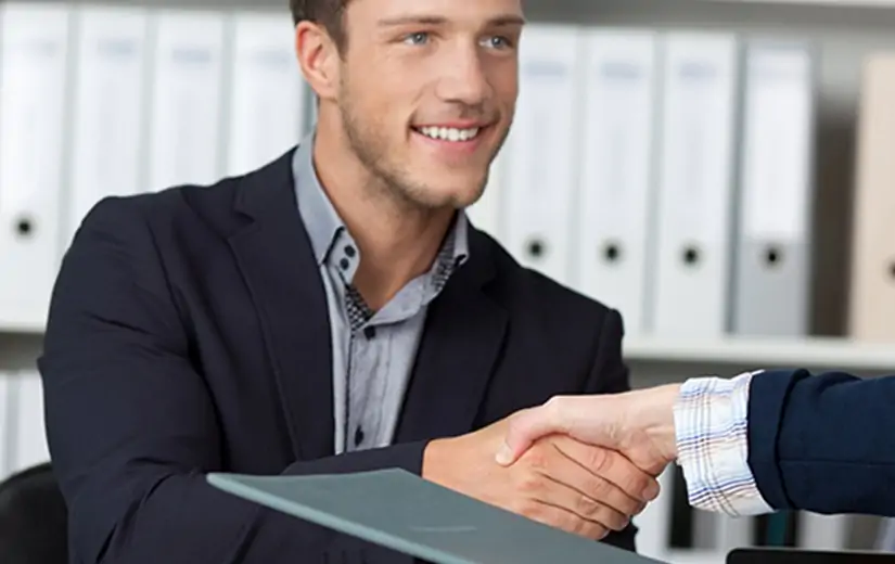 Office workers shaking hands